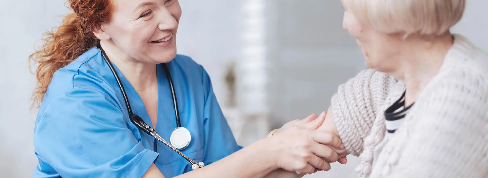 woman doctor checks female patient 